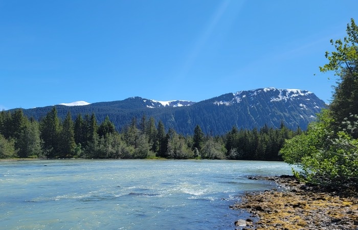 campsite view of river and mountains in juneau alaska