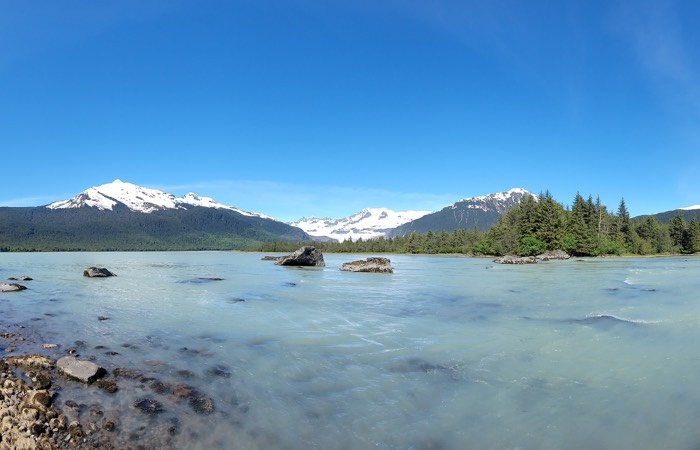 Campsite view of water and mountains in the background juneau alaska