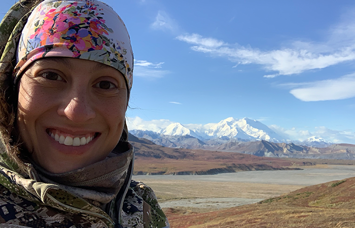 melissa posing in front of denali mountains in alaska