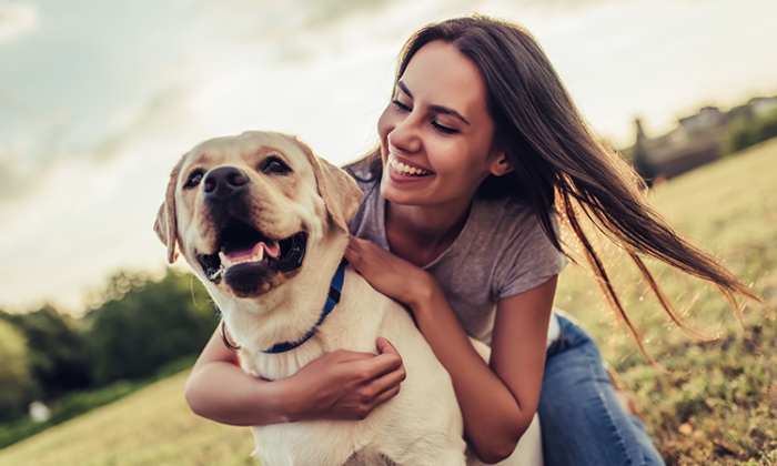 WOMAN WITH HAPPY DOG OUTSIDE