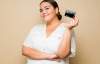 TRUE NORTH FEDERAL CREDIT UNION WOMAN HOLDING A TRUE NORTH CREDIT CARD
