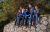 family seated together looking out to the water